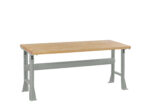 A wooden workbench with a light brown top and sturdy gray metal legs and frame, featuring adjustable height settings. The design is simple and functional, suitable for various workshop or garage activities.