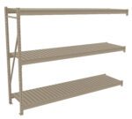 A beige, three-tier metal storage shelf with horizontal slatted shelves and vertical support beams on one side, designed for heavy-duty storage. The shelves are evenly spaced, and the structure stands on a flat surface.