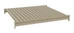 A beige, rectangular, corrugated metal platform with vertical grooves and raised edges on three sides. The platform appears to be elevated and is set against a plain white background.