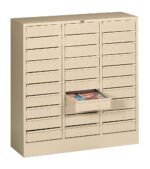 A beige metal storage cabinet with multiple small drawers. One drawer is opened, revealing documents or files inside. The cabinet is designed for organizing and storing papers or small office supplies.
