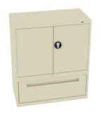 A beige, two-door metal cabinet with a black round handle on the front. It has a large drawer at the bottom. The design is simple and functional, suitable for office or home storage.