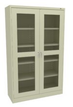 A tall, beige metal cabinet with two glass-paneled doors revealing four adjustable shelves inside. The cabinet has two silver handles and a simple, modern design.