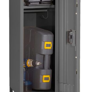 A tall, grey metal cabinet with an open door revealing a power drill and tool case on the bottom shelf, and a closed case on the upper shelf. The cabinet stands on four legs.