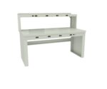 A white industrial workbench with a smooth surface and a raised back shelf. It has several power outlet access points along the top and front edges. The design is functional, suitable for technical or laboratory work.