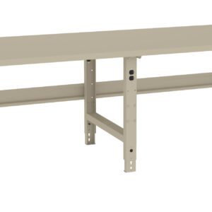 A beige, heavy-duty workbench with adjustable metal legs and a flat rectangular surface. It has a sturdy frame and is designed for industrial or workshop use.