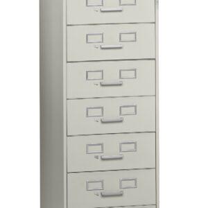 A tall, light gray filing cabinet with six drawers, each featuring a label holder and handle. The cabinet is slightly angled to the left, showing depth and structure.