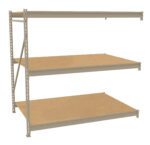 A beige metal shelving unit with three wooden shelves, designed for storage and organization. The frame features angled supports for stability, and the shelves are evenly spaced. The unit is photographed against a plain white background.