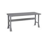 A gray metal workbench with a rectangular top and four sturdy legs. It features a horizontal support beam connecting the legs on each side. The simple design suggests it is suitable for industrial or workshop use.