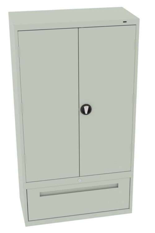 kyenydvnwniriirzljya.jpg A tall, light gray metal storage cabinet with two closed doors and a lower pull-out drawer. The cabinet features a round lock mechanism on the front.