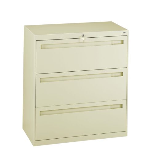 A beige, three-drawer lateral filing cabinet with a lock on the top drawer. The drawers have recessed handles for opening. The cabinet is standing on a flat surface against a white background.