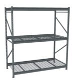 Gray metal storage shelving unit with three wire mesh shelves. The structure is supported by vertical beams with multiple holes for adjustable shelving, and diagonal braces provide additional stability. The unit is empty and placed against a white background.