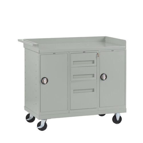 Gray metal utility cart with four wheels. It has two cabinets with circular handles on either side and three central drawers. A handle protrudes from the top left side. Suitable for storage and organization in workshops or garages.
