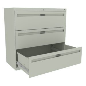A light gray, metal filing cabinet with three drawers is shown. The top two drawers are closed, while the bottom drawer is open, revealing an empty interior. The cabinet is viewed at a slight angle from the front.