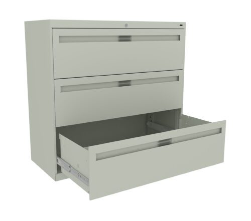 A light gray, metal filing cabinet with three drawers is shown. The top two drawers are closed, while the bottom drawer is open, revealing an empty interior. The cabinet is viewed at a slight angle from the front.