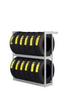 A metal rack with two shelves holding several black tires. Each tire has a bright yellow label affixed to its tread. The rack is positioned against a plain white background.
