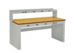 A gray workbench with a light wooden top and a sturdy design. It features multiple electrical outlets on the backboard and beneath the surface, suitable for workshops or labs.