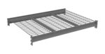 A gray metal industrial shelf with a grid design and two horizontal support bars is depicted. It features side brackets for mounting and has a rectangular shape.