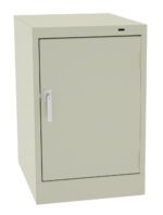 A light gray metal storage cabinet with a single door and a silver handle, shown against a plain white background. The cabinet is rectangular and stands vertically.