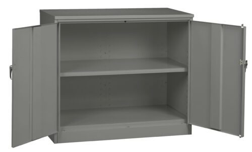 mnzduwfp2ksllgrrlnxt.jpg A gray metal storage cabinet with two open doors, revealing one internal adjustable shelf. The cabinet has simple handles and a plain design, suitable for office or industrial use.