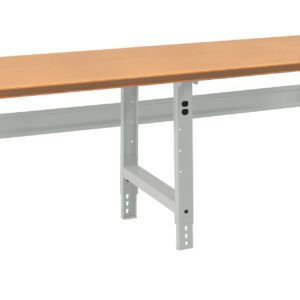 A long, rectangular workbench with a light brown wooden top and adjustable metallic legs. The legs are gray and have multiple holes for height adjustment. The bench is set against a plain white background.