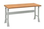 A rectangular table with a wooden top and gray metal legs, positioned against a white background. The table features a sturdy, industrial design.
