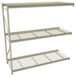 A metal shelving unit with three wire mesh shelves, supported by vertical and horizontal bars. The structure is gray and appears sturdy, suitable for storage in a garage or warehouse setting. The background is plain white.