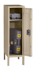 A beige metal storage locker with the door open, revealing a shelf with a black bag and a lower compartment holding a power tool box and a power drill placed upright. The locker stands on four legs.