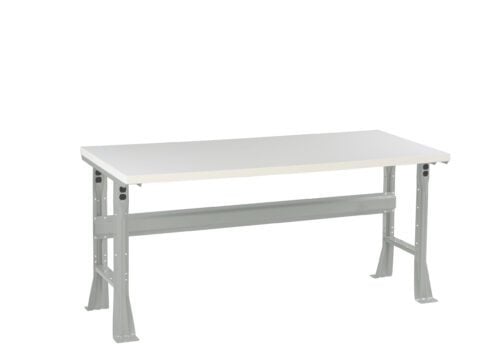 A rectangular, light gray workbench with adjustable-height legs and a sturdy horizontal support bar. The surface is flat and appears smooth. The design is simple and industrial.