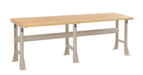 A long, rectangular wooden workbench with a smooth surface and metal legs. The bench has a natural wood finish and beige-colored legs, suitable for workshops or garages.