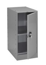 A gray metal cabinet with an open door revealing two shelves inside. The door has a round lock with a pair of keys hanging from it. The cabinet is simple and industrial in design.