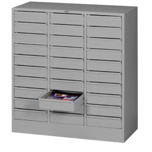 A gray metal storage cabinet with multiple small drawers, one of which is open, revealing stationery items inside. The cabinet features a uniform, industrial design with handle pulls on each drawer.