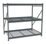 A large, industrial metal shelving unit with three mesh shelves and a sturdy frame. The design is open and metallic, intended for heavy-duty storage or warehouse use.