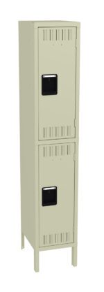 A beige metal locker with two compartments, each with a black handle and ventilation slits. The locker stands on four legs and has a simple, utilitarian design.