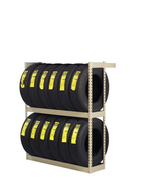 A metal storage rack holding two rows of new black tires, each with a yellow label. The rack is beige and neatly displays the tires against a plain white background.