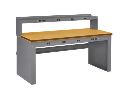 A large, gray workbench with a wooden tabletop and a raised back panel containing multiple power outlets. The bench is designed for industrial or technical use, providing ample workspace and tool connectivity.