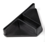A black, triangular plastic object with three compartments, designed for sorting or holding items. It features raised edges and a smooth surface, positioned on a white background.