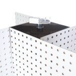 A close-up shows the Vulcan SP REVOLVER PB-16, a white perforated pegboard with interlocking sections forming right angles. A transparent bracket at the top adds stability, making it a robust and flexible solution for efficiently organizing tools or accessories.