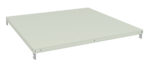 A light gray, rectangular metal shelf with holes along its edges and a smooth surface, shown from an angle on a white background.