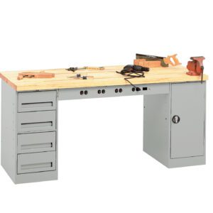 A wooden-topped workbench with a gray metal base, featuring drawers on the left and a cabinet on the right. On top are various tools, including a clamp, a measuring square, a saw, and pliers.