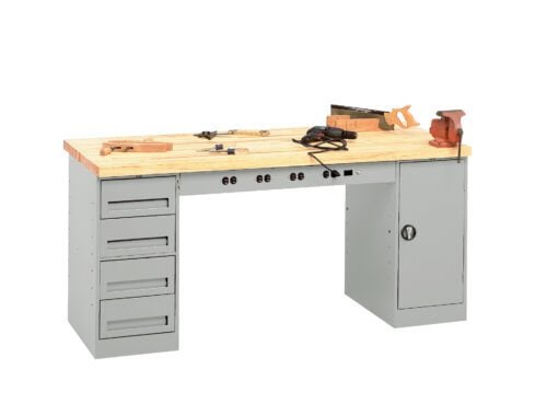 A wooden-topped workbench with a gray metal base, featuring drawers on the left and a cabinet on the right. On top are various tools, including a clamp, a measuring square, a saw, and pliers.