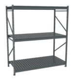 A large, gray, metal shelving unit with three tiers. It features a sturdy frame with diagonal support bars and slatted shelves, suitable for industrial or garage storage. The unit is empty and stands against a plain white background.