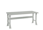 A grey metal workbench with a flat rectangular top and sturdy legs. A horizontal support beam connects the legs for added stability. The design is simple and industrial, suitable for various workspaces.