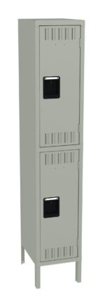 A tall, gray metal locker with two compartments stacked vertically. Each compartment has a black handle and ventilation slits. The locker stands on four legs.