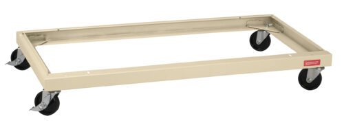 rlhmg3rybekxgm04hk5e.jpg A beige rectangular metal dolly with four black swivel caster wheels. The frame is designed for transporting rectangular items, providing stability and mobility. A small red label is visible on one side of the frame.