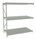 A green metal shelving unit with three tiers, each consisting of evenly spaced slats. The unit has a vertical frame on the left side and lacks a frame on the right, giving an open-ended appearance.