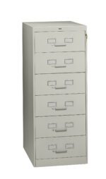 Tall, light gray metal filing cabinet with five drawers and label holders on each drawer. The cabinet has a lock on the right side near the top.