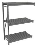 A three-tier gray metal shelving unit with slatted shelves and vertical support beams on one side. The shelves are evenly spaced, and the unit has a minimalist, industrial design.