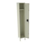 A light gray metal locker with a single door stands open, revealing an empty interior with a single shelf at the top. It has a black handle and is supported by four legs. The locker is positioned at an angle, showing the inside.