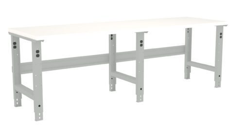 t5c74ssspqbj0jjdyfjr.jpg A long, white workbench with adjustable metal legs. The bench has a simple, sturdy design, suitable for various tasks in a workshop or garage setting.