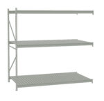 Metal shelving unit with three slatted shelves, supported by a vertical frame on the left side. The shelves are evenly spaced and aligned horizontally. The overall color is light gray.